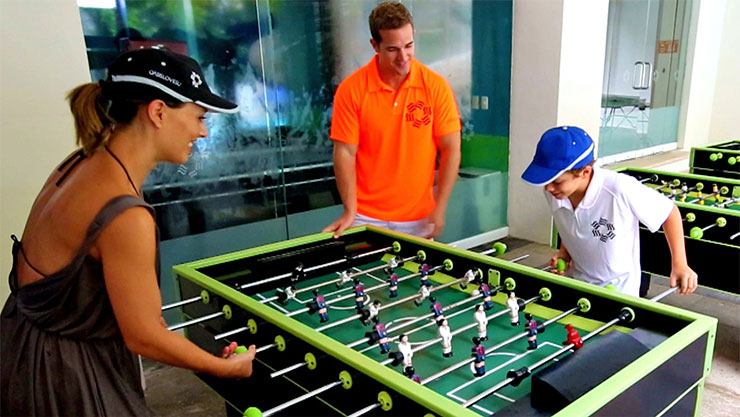 Kids playing foosball