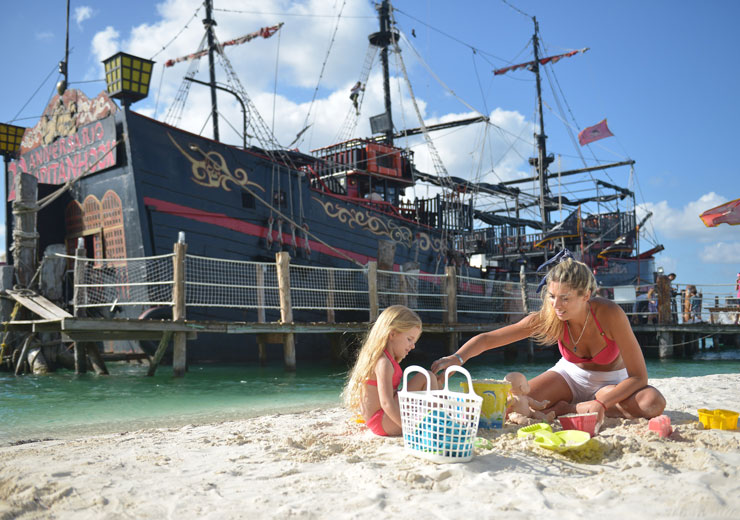 Mom enjoying the beach with kids